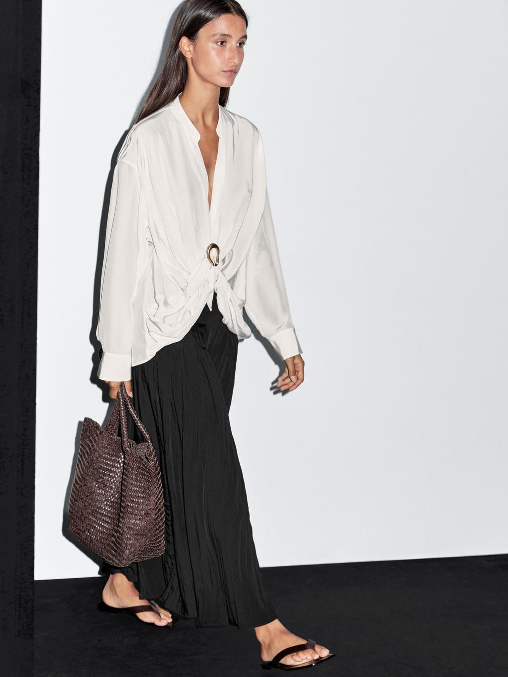 Blouse with knotted neckline and brooch detail