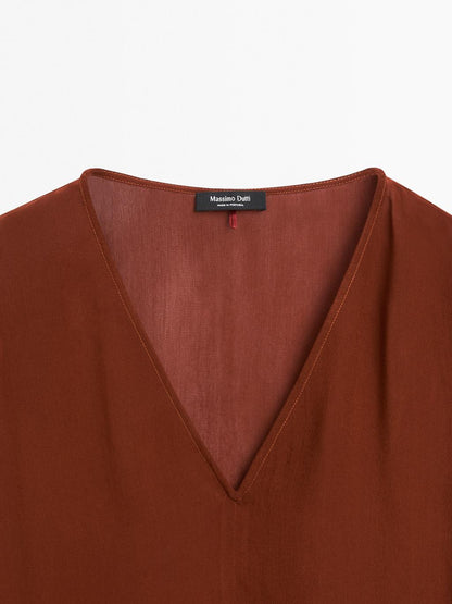 Cape-style blouse with ruffles