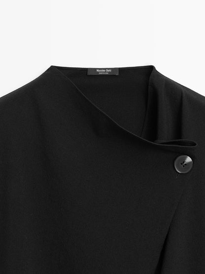 Blouse with crossover detail and button